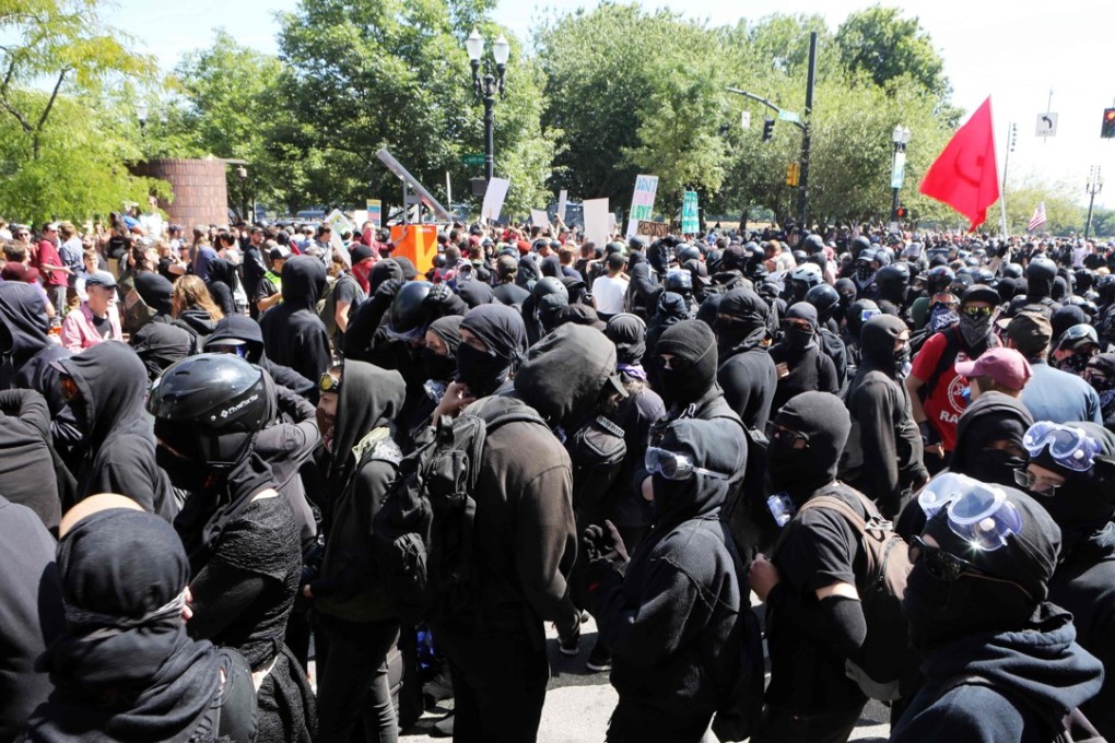 Protesters from the right and left converging at a rally in Portland, Oregon, on Saturday. Police were out in force and braced for violence. Photo: AFP
