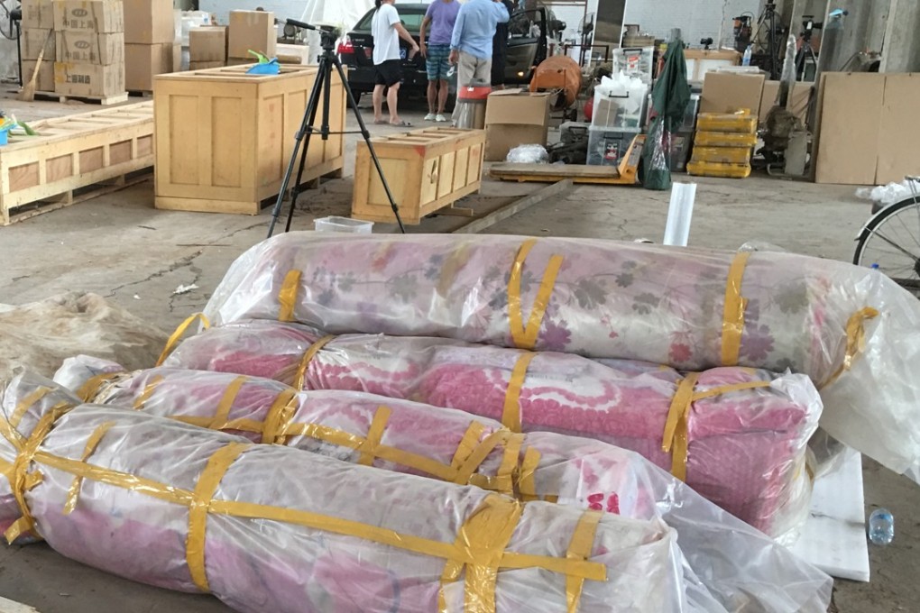 Some of the art in Ai Weiwei's studio in Beijing is packed and awaiting removal as demolition work on the building continues. Photo: Elaine Yau