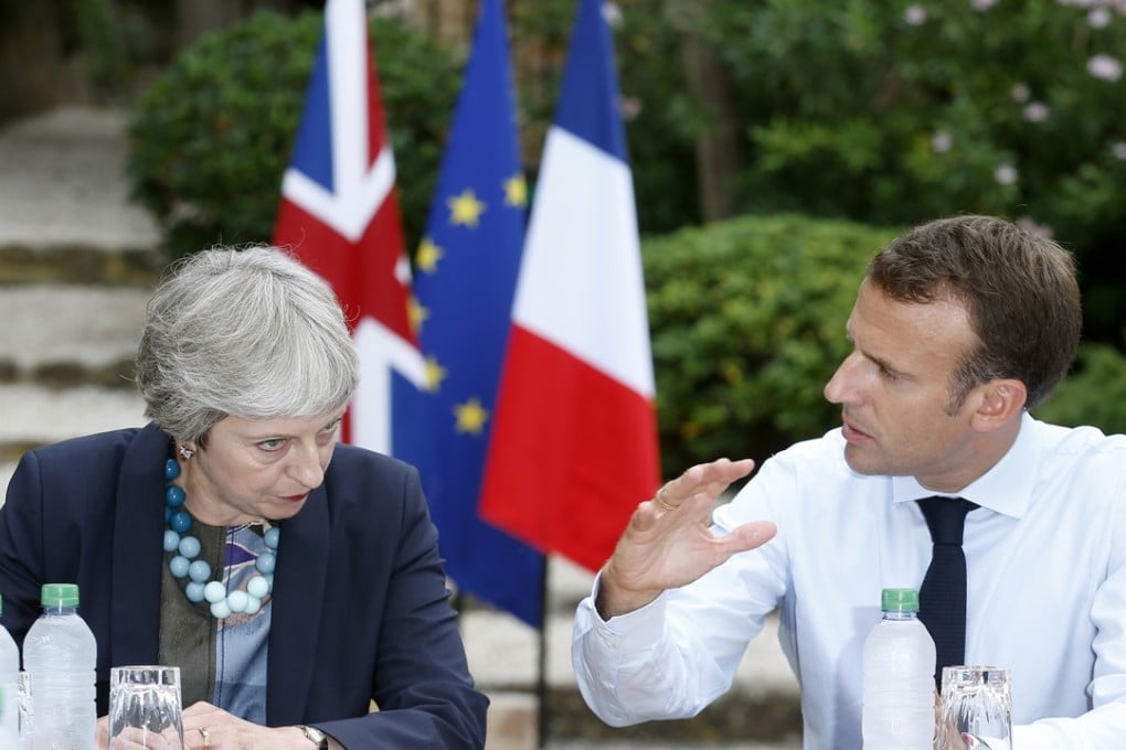British Prime Minister Theresa May, left, discussing Brexit issues with French President Emmanuel Macron this month in Bornes-les-Mimosas, France. Photo: AP