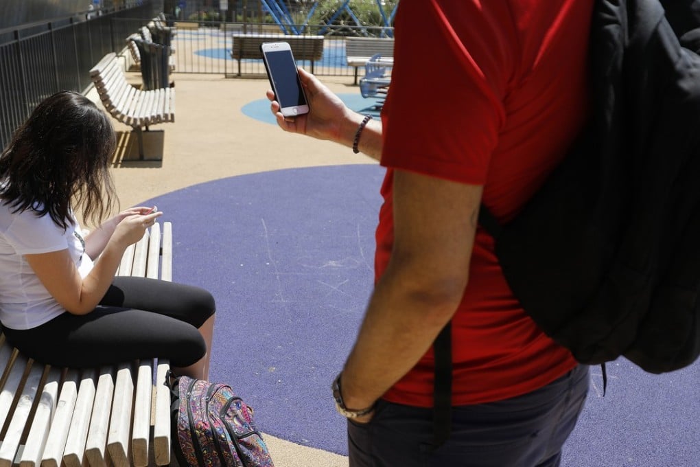 The French parliament recently voted for a ban on mobile phones and related devices in schools and colleges. Photo: EPA