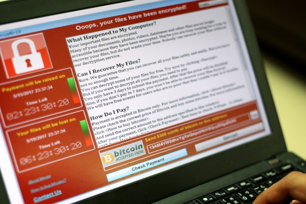 A programer shows a sample of a ransomware cyberattack on a laptop in Taipei, Taiwan, 2017. Photo: EPA
