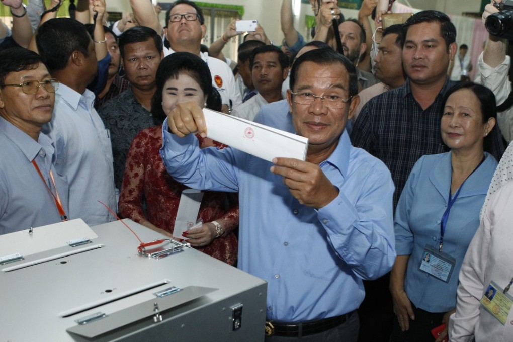 File photo of Cambodian Prime Minister Hun Sen holding a ballot before voting in Takhmua in Kandal province, southeast of Phnom Penh, Cambodia. Photo: AP
