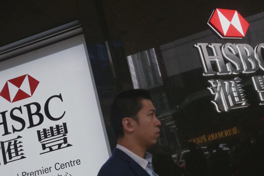 HSBC has been dramatically reshaping itself following the tumult of the global financial crisis. Above, a man walks past an HSBC branch in Central. Photo: David Wong