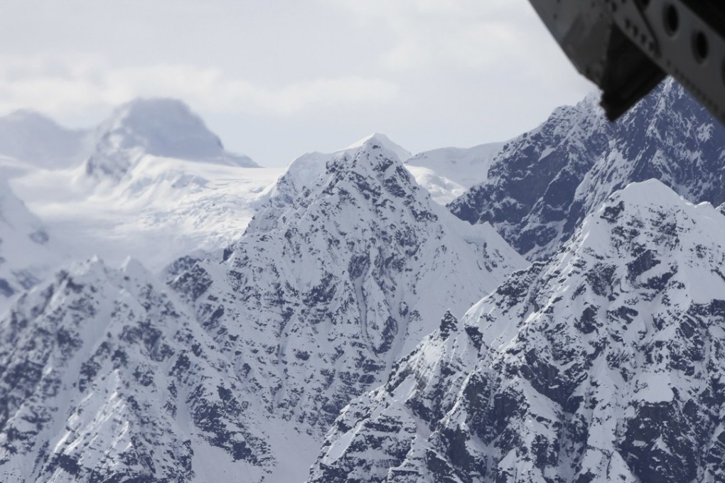 This photograph taken on April 24, 2016, above the Kahiltna Glacier shows peaks in the Alaska Range. Searchers said on Monday that they had found four people dead in a sightseeing aeroplane carrying Polish tourists in Denali National Park, a day and a half after thick clouds hampered the response to a distress call. Photo: AP
