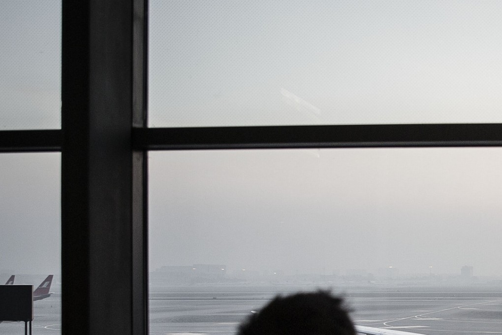 A passenger uses his mobile phone to take a picture of an aircraft at Shanghai Hongqiao International Airport. The chairman of the airport’s parent company, the Shanghai Airport Authority, is under investigation for violating Shanghai Communist Party’s discipline and laws. Photo: Bloomberg