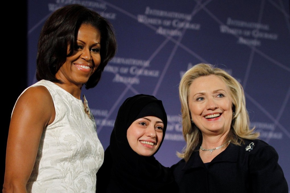 Former US secretary of state Hillary Clinton (right) and former US first lady Michelle Obama (left) congratulate Samar Badawi of Saudi Arabia during the US State Department's 2012 International Women of Courage Award winners ceremony. Badawi was arrested by Saudi authorities last week, prompting Canada to call for her release, and triggering a diplomatic furore. Photo: Reuters