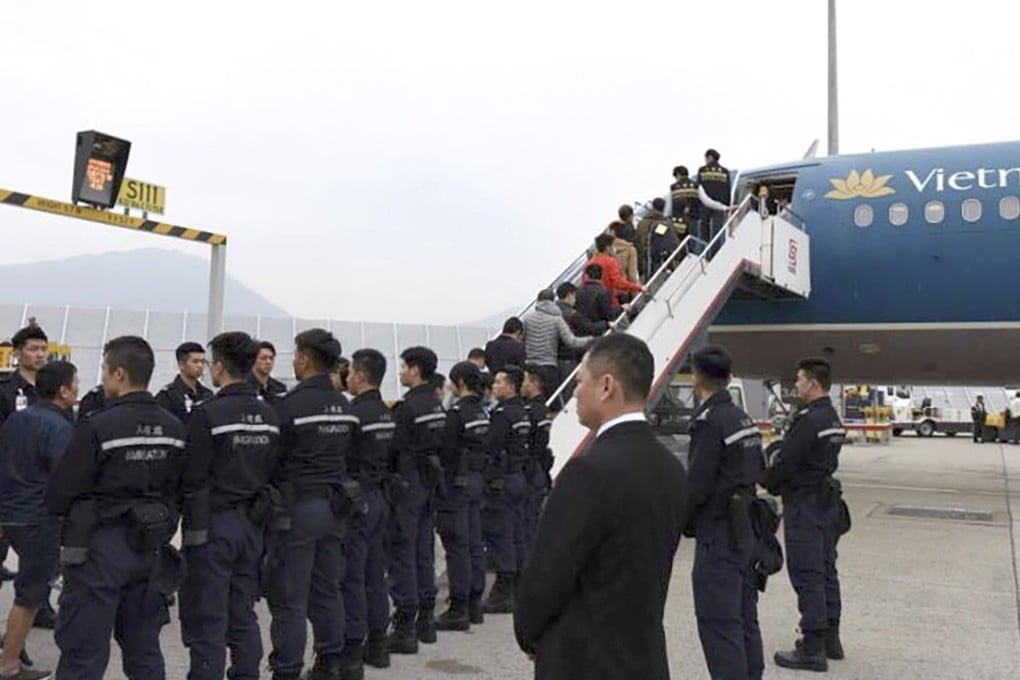 Hong Kong immigration authorities arranged a chartered flight to send 68 unsuccessful asylum seekers and illegal immigrants back to Vietnam. Photo: Hong Kong immigration authorities