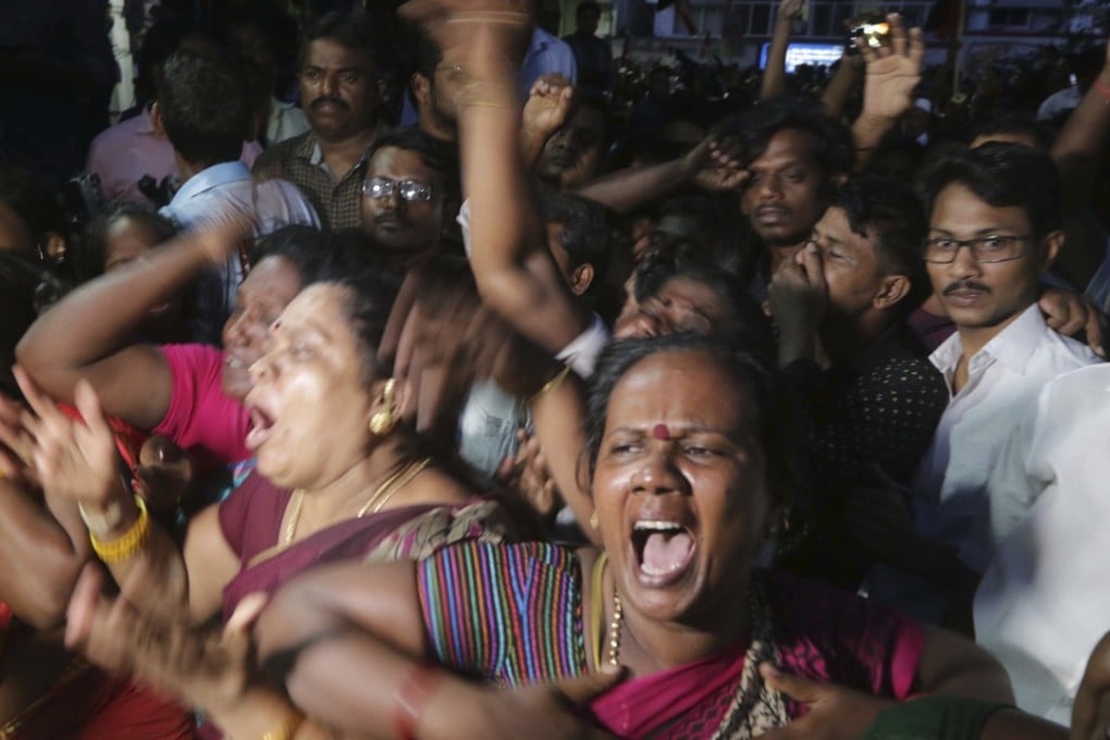 Supporters of former Tamil Nadu state chief Minister and Dravida Munnetra Kazhagam political party chief Muthuvel Karunanidhi wail upon hearing the news of his death outside the Kauvery Hospital in Chennai, India, on Tuesday. Photo: AP