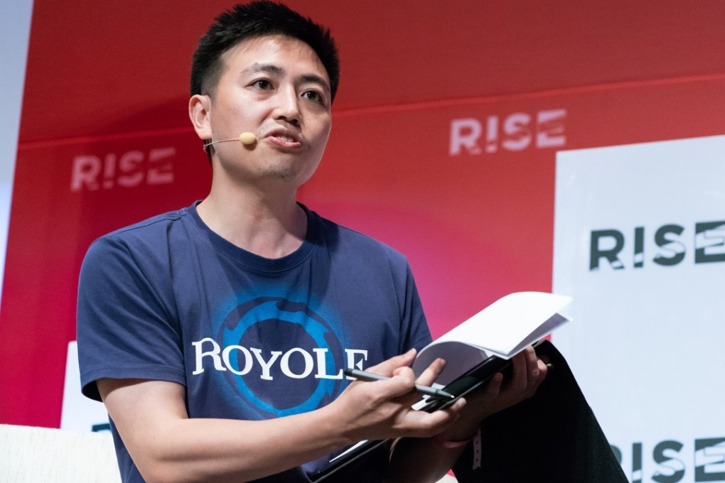 Bill Liu, co-founder, chairman and chief executive of Royole Corp, speaks during the Rise conference in Hong Kong in July. He said the firm is working on potential deals with smartphone manufacturers and carmakers. Photo: Bloomberg