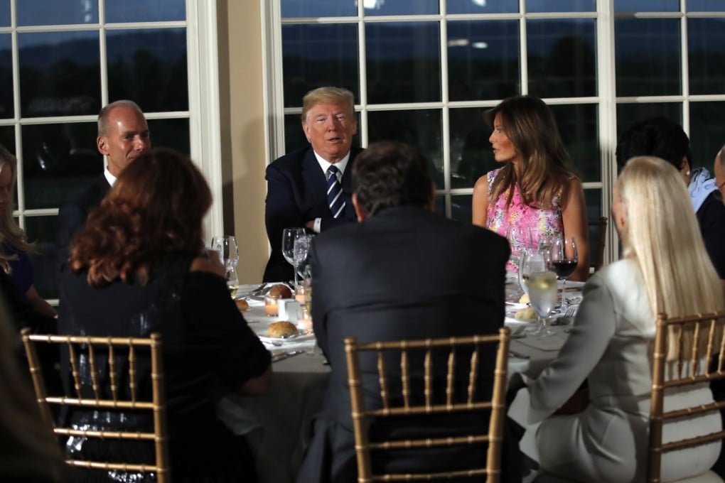 President Donald Trump entertained a group of 13 CEOs and senior White House staff at a dinner in the middle of his annual working vacation on Tuesday night. Photo: AP