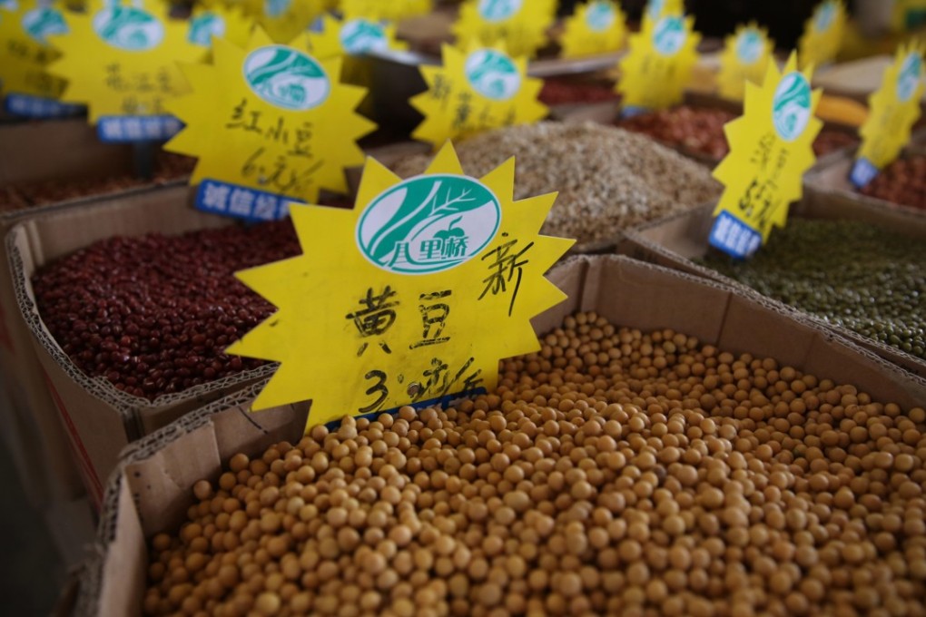Soybeans for sale are displayed in a grain wholesale market in Beijing on July 31. Photo: EPA-EFE