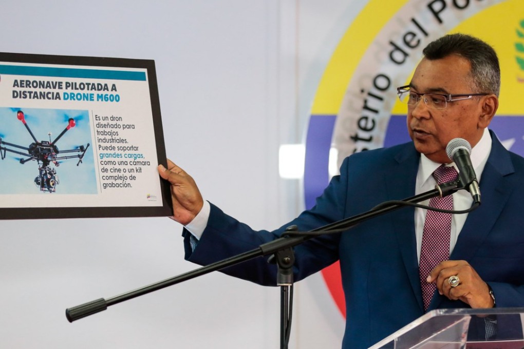 Venezuela's Interior and Justice Minister Nestor Reverol holds a placard with a picture of a drone during a news conference in Caracas about the drone attack on President Nicolas Maduro. Photo: Reuters.