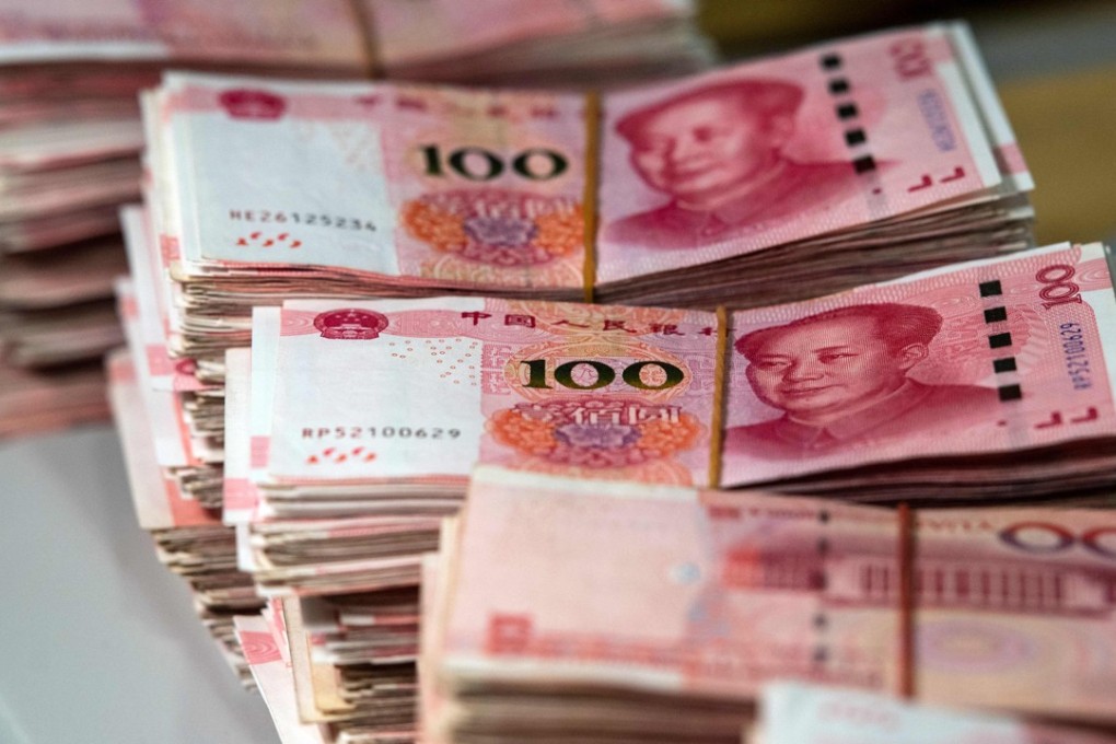 The People’s Bank of China devalued the yuan by nearly 3 per cent against the US dollar in two days on August 11 and 12, 2015. Photo: AFP