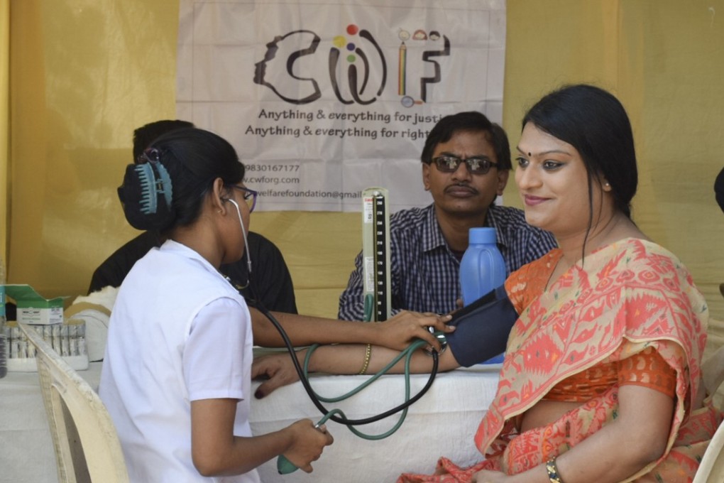 A transgender person receives a medical check-up provided by the Civilian Welfare Foundation, based in Kolkata, India.