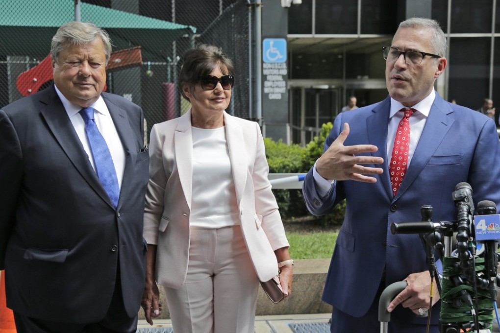 Vikto and Amalija Knavs listen as their attorney Michael Wildes, right, makes a statement in New York, Thursday, after they were sworn in as US citizens. Photo: AP