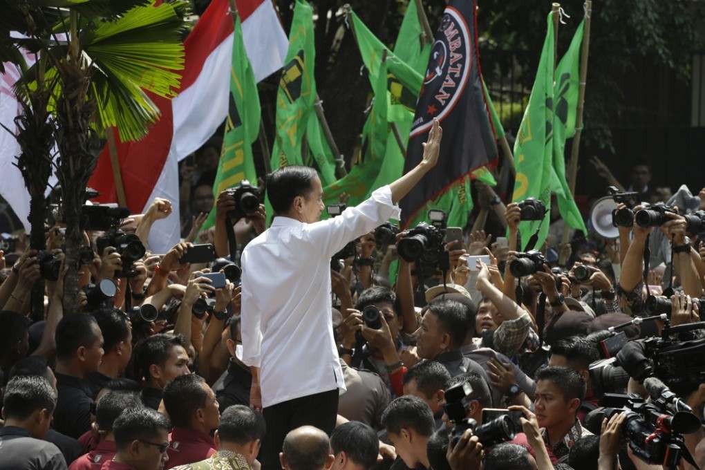 Indonesian President Joko Widodo greets supporters. Photo: AP