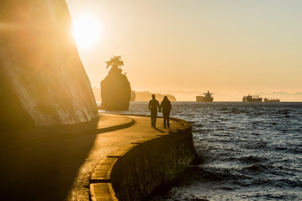 Stanley Park seawall at sunset, in Vancouver, Canada. Picture: Alamy