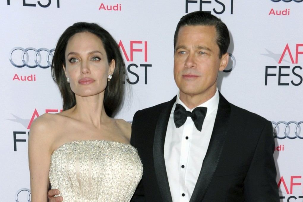 In this November 5, 2015 file photo, Angelina Jolie and Brad Pitt arrive at the 2015 AFI Fest opening night premiere of “By The Sea” in Los Angeles. Jolie Pitt says she wants her divorce from Brad Pitt finalised before the end of the year, and that she intends to seek retroactive child support. Photo: AP