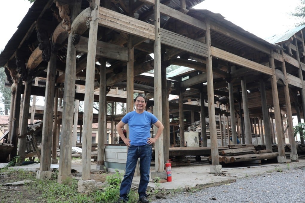 Sam Jan in the Beijing compound in which he stores old wooden structures he has sourced from eastern China. Picture: Simon Song