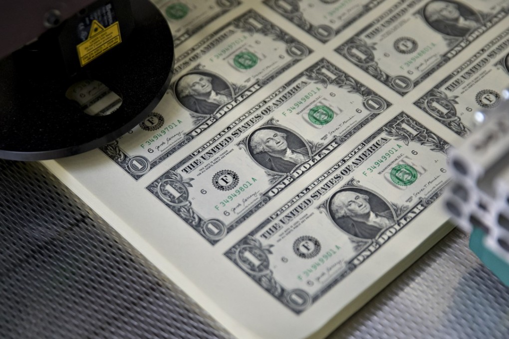 Stacks of uncut sheets of US$1 dollar notes sit in a machine at the US Bureau of Engraving and Printing in Washington on November 15. The dollar’s value has been strong this year, despite expectations and most external indicators. Photo: Bloomberg