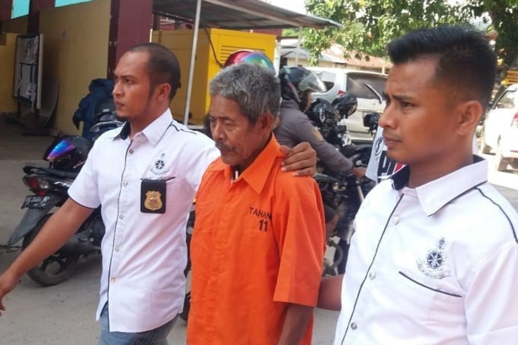 The shaman is taken into custody. Photo: Muhammad Sabran