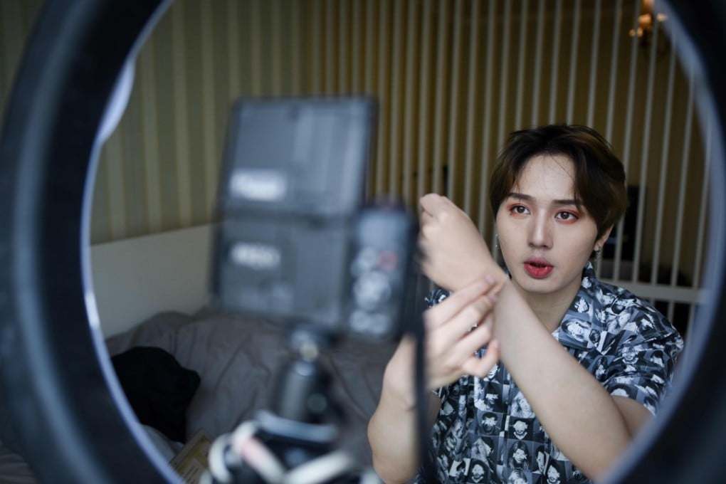 Lan Haoyi, known online as Lan Pu Lan, introduces a product while filming at his home in Beijing. Photo: AFP