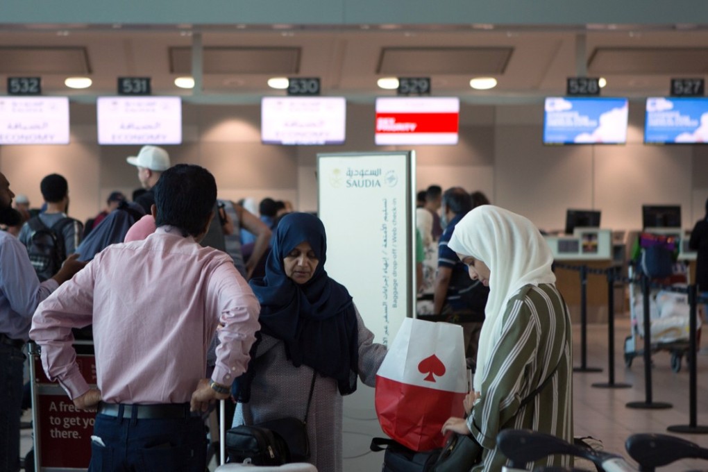 Passengers prepare to check in for the last direct flight by Saudi Arabian Airlines from Toronto Pearson International Airport to Riyadh, Saudi Arabia, on Friday. Photo: Reuters