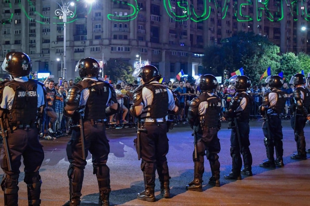 A demonstration to protest against the government on Saturday in front of the government’s headquarters in Bucharest, Romania. Photo: AFP