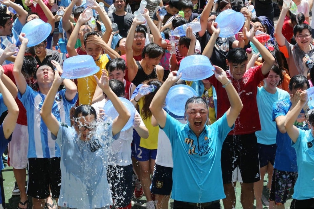 Participants take part in an Ice Bucket Challenge at King George V Memorial Park in West Kowloon. Photo: Felix Wong
