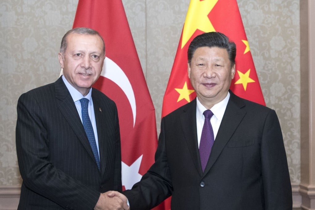 Chinese President Xi Jinping (R) meets with his Turkish counterpart Recep Tayyip Erdogan in Johannesburg, South Africa on July 26, 2018. Photo: Xinhua/Wang Ye