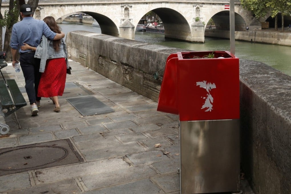 One of the bright red urinals on the Ile Saint-Louis along the Seine River in Paris, France. Photo: Reuters