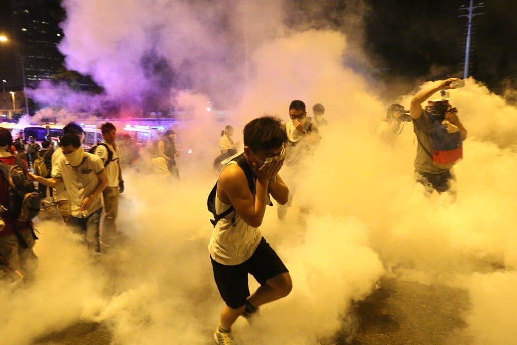 The police fire tear gas at protesters in Admiralty after Occupy Central was officially launched in September 2014. Photo: Sam Tsang