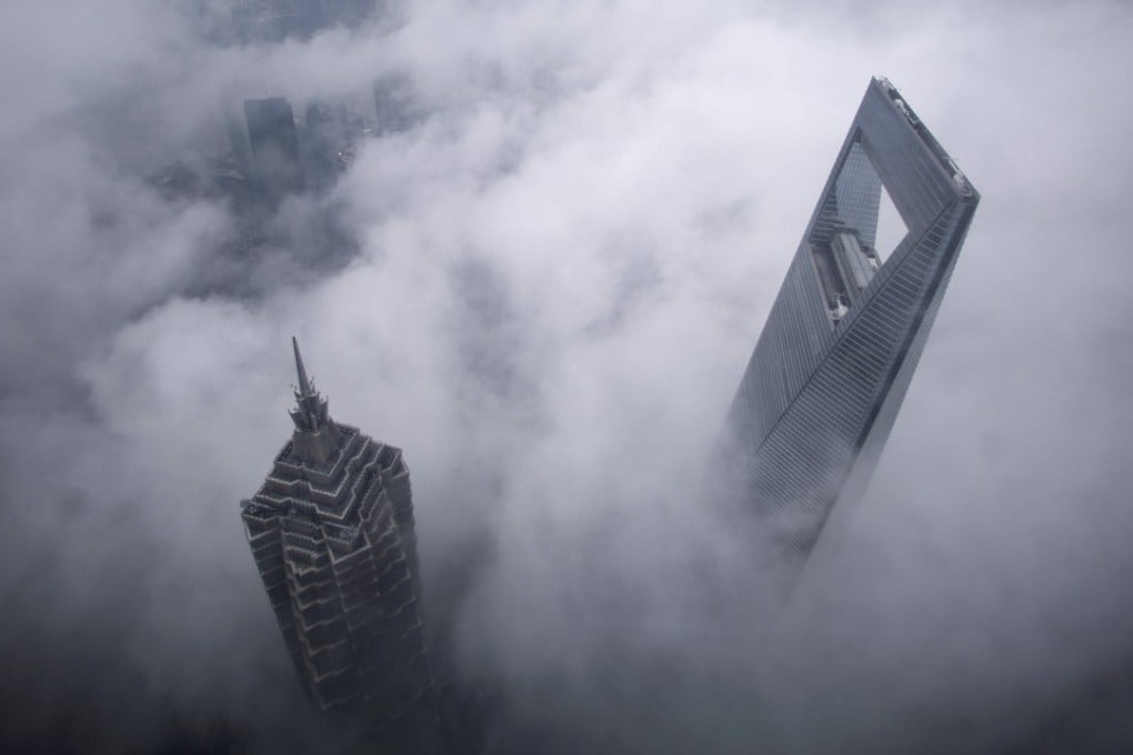 The World Financial Centre (right) and Jin Mao Tower emerge from the clouds during heavy rain in the financial district of Pudong in Shanghai, in May 2015. China is braced against a deluge of tariffs on its goods imposed by US President Donald Trump. Photo: Reuters