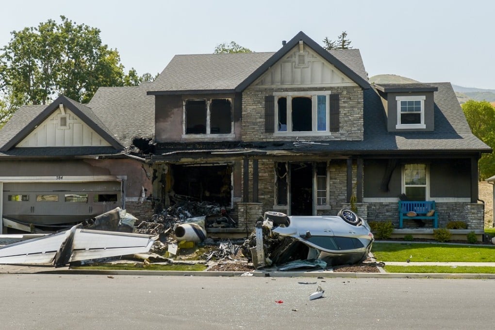This photo shows a damaged house after a plane crash in Payson, Utah, on Monday. Photo: AP