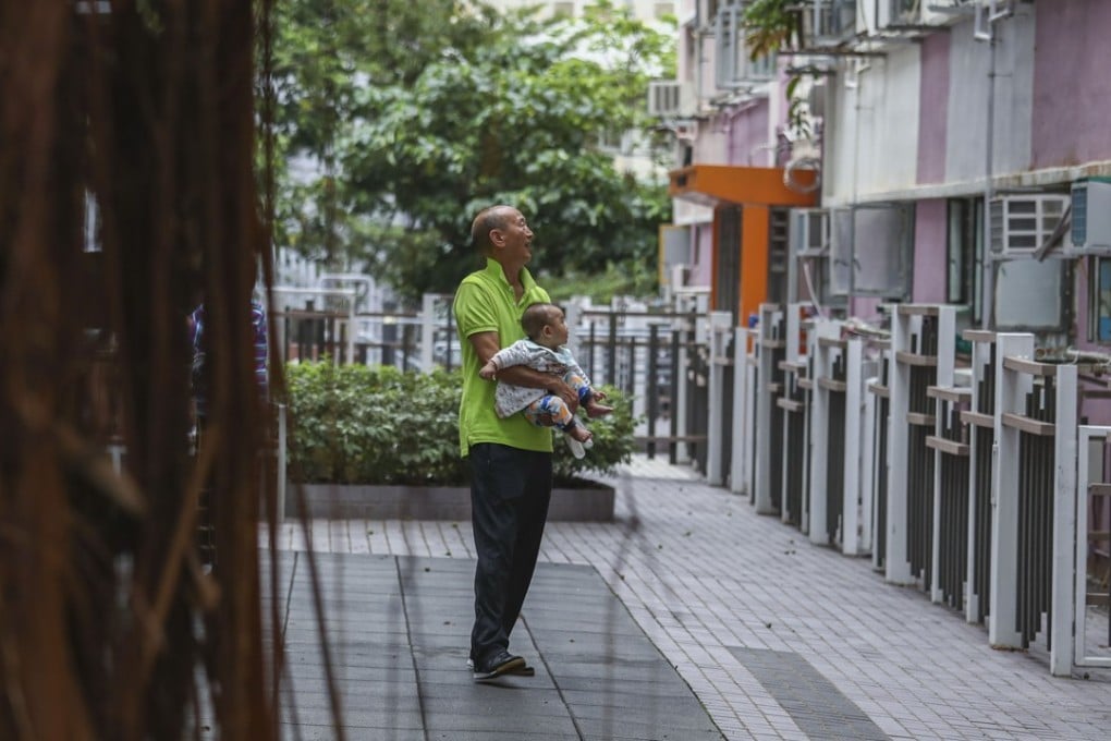 An elderly man and a child at Yue Kwong Chuen estate in Aberdeen in May 2018. Hong Kong has one of the lowest infant mortality and highest life expectancy rates in the world. Photo: Nora Tam