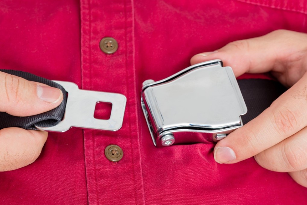 It may seem obvious but buckling up on a flight really will protect your health. Photo: Alamy