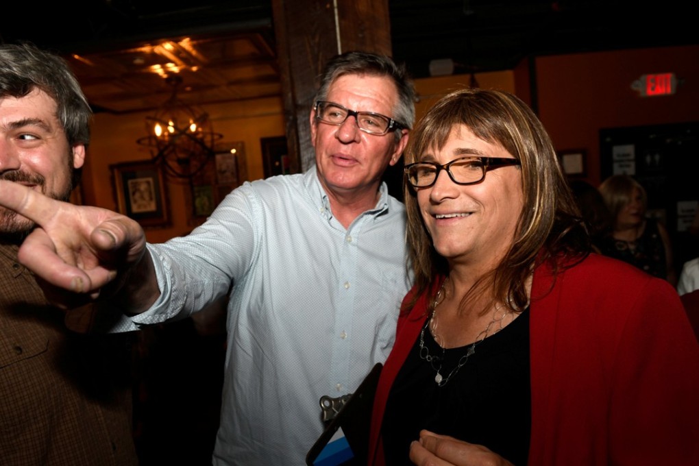 Vermont Democratic Party gubernatorial primary candidate Christine Hallquist (right), a transgender woman, attends her election night party with Matt Cropp, left, and Val Davis, in Burlington, Vermont. Photo: Reuters