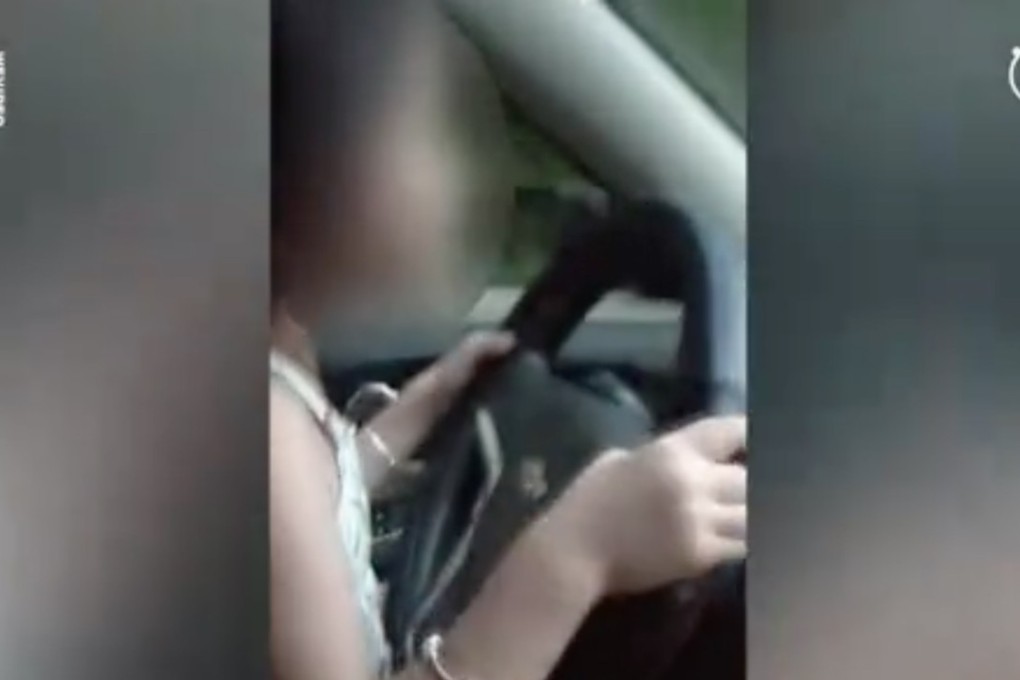 A couple from central China were detained and fined for allowing their six-year-old daughter steer their car. Source: Miaopai