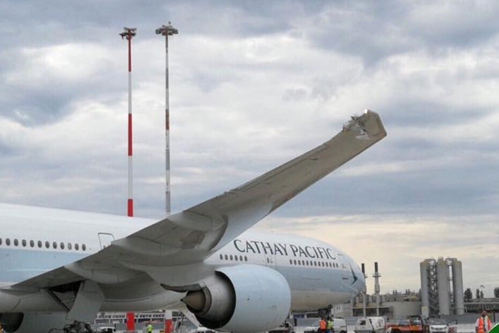 A Cathay Pacific Boeing 777 was towed into a light pole in Rome, damaging the wing tip. Photo: Rome Aviation Spotters Facebook page