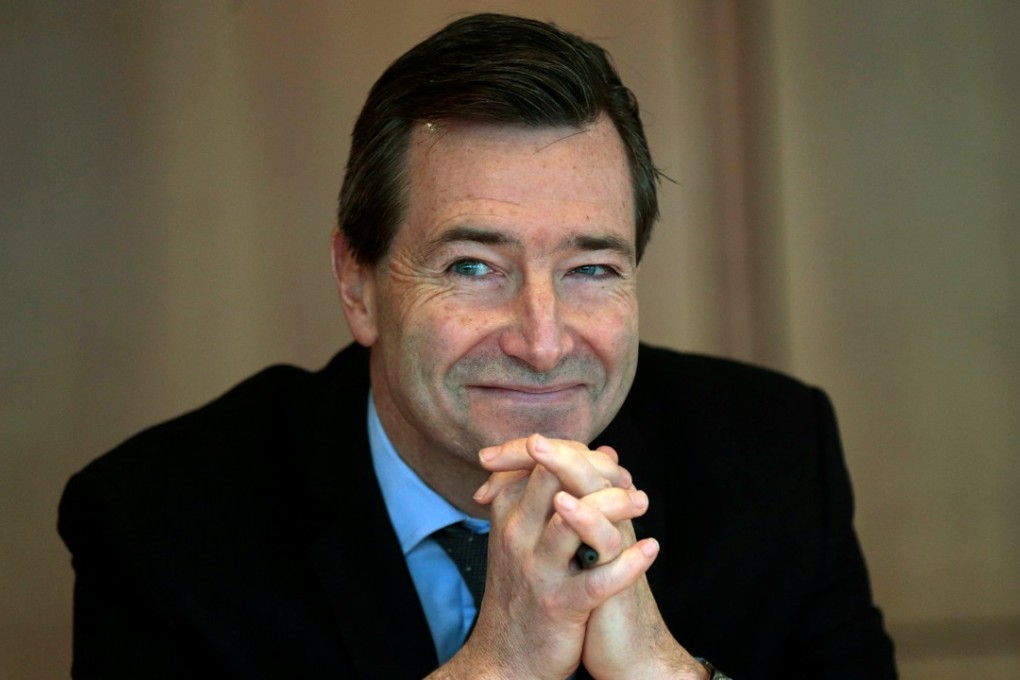 Financial Times Chief Executive Officer John Ridding reacts during an interview at the Financial Times headquarters in London. Photo: Reuters