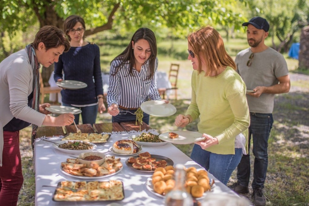A group of local women called La Mamme del Borgo, or ‘Village Mothers’, preparing food for lunch in Sicily as part of a culinary tour around the island. Photo: Chris Dwyer