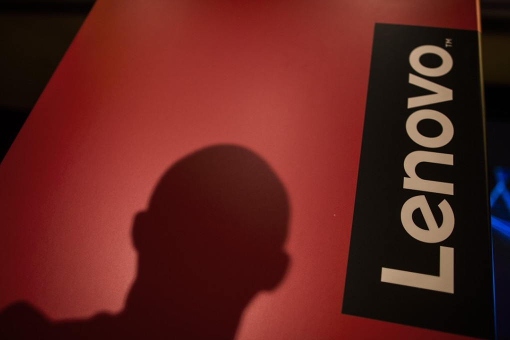 The shadow of an attendee sits on a podium wall during a Lenovo Group Ltd. news conference in Hong Kong, China, on Thursday, May 26, 2016. Lenovo posted fourth-quarter profit that missed analysts' estimates as it struggles to revive the Motorola smartphone brand and the personal computer market continues to slide. Photographer: Justin Chin/Bloomberg