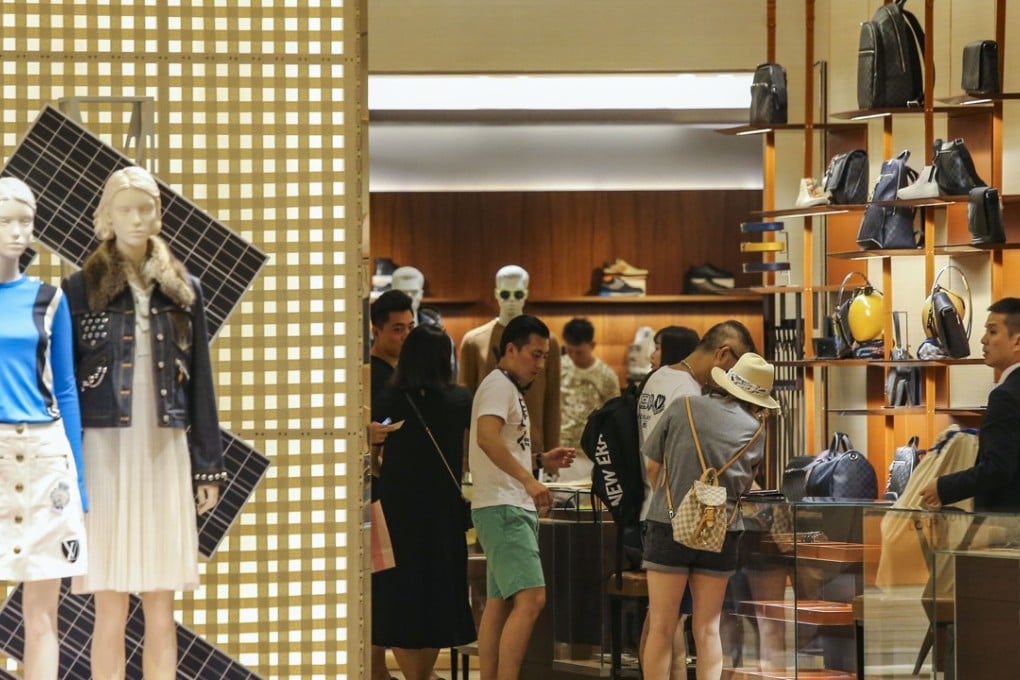 Shoppers at the Times Square shopping mall in Causeway Bay in July. Hongkongers, especially retail staff, are often perceived as rude or stand-offish by visitors, when they might just be under pressure. Photo: Dickson Lee