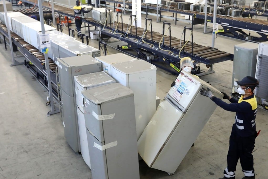Staff work at Hong Kong government's waste electrical and electronic equipment (WEEE) processing facility in Ecopark in Tuen Mun. Photo: Edward Wong