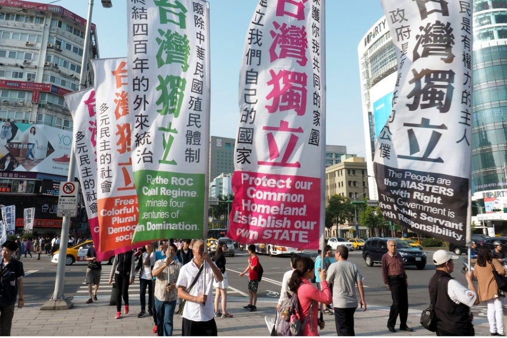 Banners demand Taiwan independence in a parade in Taipei last year. Photo: EPA