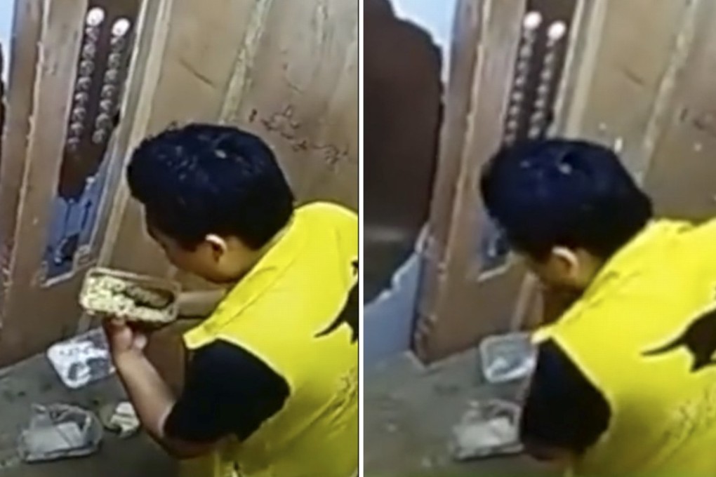 The delivery man was filmed on CCTV eating in the lift. Photo: ifeng.com