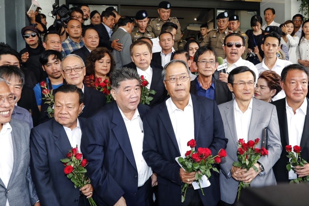 Pheu Thai Party leaders leave the crime suppression division in Bangkok after being charged with sedition and violating the ban on gatherings. Photo: AFP