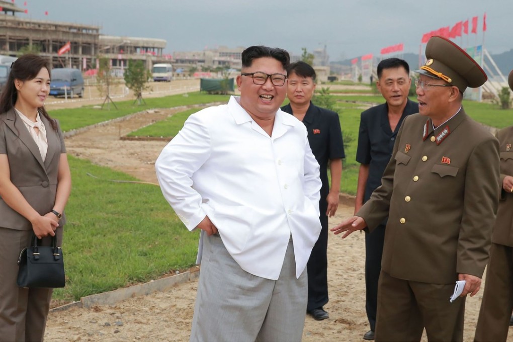 North Korean leader Kim Jong-un and his wife Ri Sol-ju (left) inspecting a building site in Kangwon province. Photo: AFP