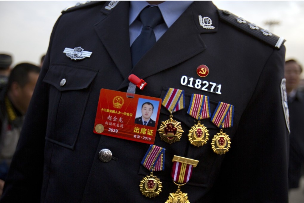 A police delegate from the Xinjiang Uygur autonomous region wears medals on his uniform as he arrives for the opening session of China’s National People’s Congress at the Great Hall of the People in Beijing, in March this year. Anyone with even a cursory knowledge of Xinjiang’s history would not be surprised by the problems of this restive region. Photo: AP