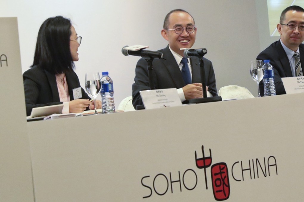 Soho China chairman Pan Shiyi (centre) speaks at a press conference to announce the company’s first-half results. Photo: Handout